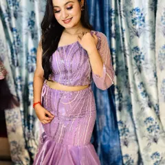 A client trying on a beautiful lavender fishtail gown in my studio. It's always a pleasure to help you find the perfect dress.
