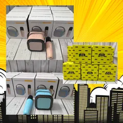 A closer look at the mini Bluetooth karaoke speakers that were included in the Batman hampers, along with the themed boxes used for packaging.