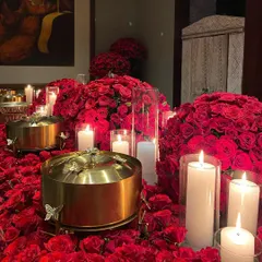 We transform spaces into immersive dining settings. This breathtaking tablescape, set amidst a sea of red roses and candlelight, showcases our commitment to creating a truly romantic and unforgettable atmosphere for your most intimate gatherings.