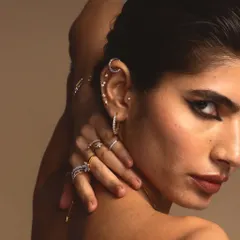 A bolder look for the same Guyal India jewellery campaign. Here, a sharp, graphic winged liner adds a touch of drama to highlight the edgy ear cuffs and rings.