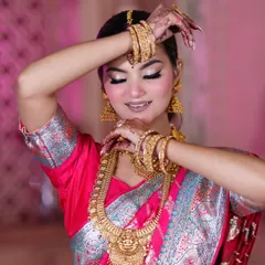 A beautiful, artistic pose from our South Indian bridal shoot. The focus is on the expressive eyes and the intricate henna design.