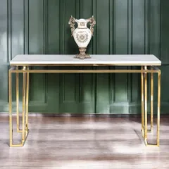The Square Piped Marble Top console table offers a more linear and minimalist design. The clean lines of the golden base provide a sophisticated foundation for your favorite decorative items.