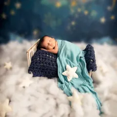Drifting in a sea of clouds and stars. I love designing these dreamy, serene setups that feel like they are straight out of a fairytale, creating a peaceful and magical portrait of your sleeping baby.