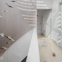 In this penthouse, I designed a helical staircase to be more than just a way to move between floors; it's a fluid, sculptural element. Bathed in light from a large skylight, its form contrasts with the clean, linear fluted wood wall, creating a focal point that is both art and architecture.