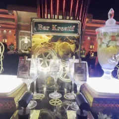 The 'Bar Kreatif' station, where I offer unique and creative beverage options. The presentation includes a large glass dispenser with infused water or sangria.