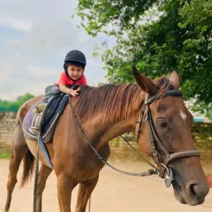 A moment of quiet confidence for this young equestrian. Our lessons are paced to make every child feel comfortable and secure.