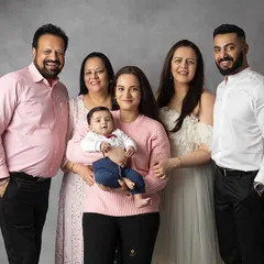 The whole family together! Extended family sessions are a wonderful way to capture multiple generations of love. The joy a new baby brings to everyone is truly special to witness.