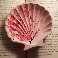 We can't get enough of hand-painting cherry blossoms. This custom-ordered mini shell dish combines a soft pink base with delicate floral art.