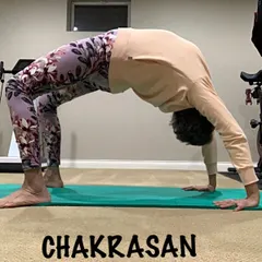 Practicing Chakrasana at home. This advanced backbend can be achieved with consistent practice of preparatory poses.