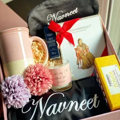 Who says you can't have it all? This luxury maid of honor hamper features a personalized robe and eye mask, a premium Forest Essentials kit, Dior lip color, a scented candle, and a stylish coffee mug.