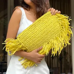 Our client Bhavini is radiating summer vibes, looking gorgeous with our yellow Raffia bag. This handcrafted accessory is the perfect statement piece to brighten up any outfit.
