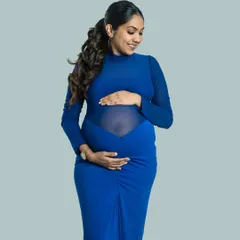 Bold and beautiful in blue. This form-fitting gown with sheer panels is a modern and stylish choice from my client wardrobe, perfect for a confident and elegant maternity portrait.