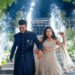 The couple dances their way down the stairs, surrounded by a shower of cold pyros. We love creating dynamic, high-energy entrances that reflect the couple's joyful personalities.