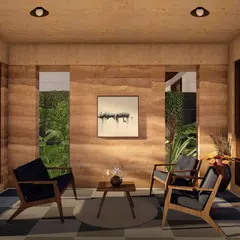 We believe in the beauty of natural materials. This sitting area in one of our Morjim villas showcases the rich texture and color of a rammed earth wall. This ancient technique not only creates stunning, layered surfaces but also helps passively cool the home, making it comfortable and energy efficient.