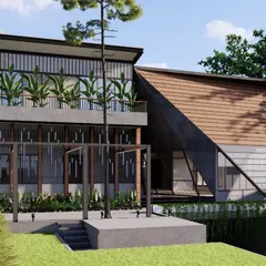 This luxury home in Mangalore features a contemporary architectural style blended with traditional materials like glass and Mangalore tiles. An angled roof slopes down to a metal framework, with large projections to mitigate the coastal climate.