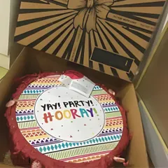 This "Yay! Party! Hooray!" piñata is boxed up and ready for delivery. It's a guaranteed way to add a burst of fun to any birthday bash.