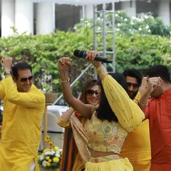 Getting the guests to dance during a daytime Haldi ceremony. My job is to break the ice and get everyone moving and enjoying the celebration.
