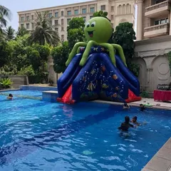 The Octopus Water Slide is designed to be placed at the edge of a swimming pool. Kids climb the inflatable and slide directly into the water, making it a perfect addition to any pool party.