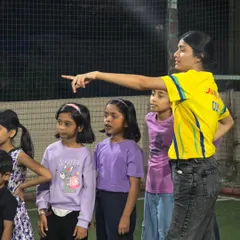 Our coach giving instructions for the next exciting game. We keep the energy high and the kids engaged with clear, fun directions, ensuring everyone knows how to play and stay safe.