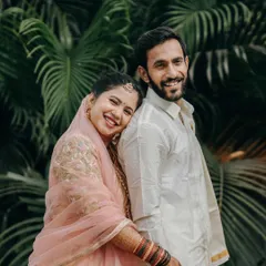 A sweet and simple portrait of Amya and Sherry. The bride rests her head on the groom's shoulder, a quiet moment of comfort and love amidst the wedding celebrations.