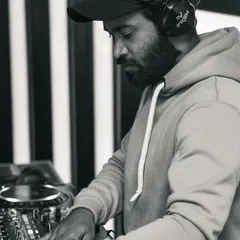 A black and white shot capturing the focus and intensity of a Saturday night set. Every weekend is an opportunity to create an incredible experience through music.