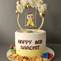 Lil Saachit begins to eat solids! The cutest pineapple cake for his Annaprashan ceremony, featuring a baby on a swing and miniature plates of traditional first foods.