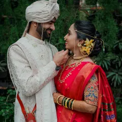 A quiet moment between the wedding rituals. I believe the most beautiful portraits are the ones that are not posed but felt, like this gentle touch that says more than words ever could. This is a classic Maharashtrian wedding couple portrait.