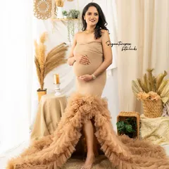 This shot captures the elegance of the gown and the warm, inviting atmosphere of the boho-chic setup.