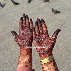 A close-up of the developed henna stain, highlighting the contrast between the fine lines and the filled-in floral motifs.