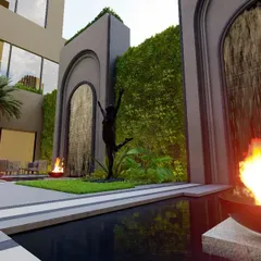 A serene hotel courtyard concept in Lucknow, where lush green walls and cascading waterfalls create an idyllic oasis. This space is designed for outdoor dining, allowing guests to unwind amidst the tranquil beauty of fire and water elements.