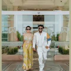 The couple making a stylish entrance to their daytime event.