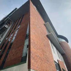 A symphony of brick and glass, designed for indulgence, connection, and creativity. This brewery facade combines industrial and modern elements to create an inviting landmark.