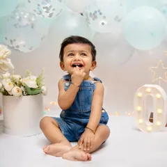 Look at that innocent wonder. My goal during milestone shoots is to capture these fleeting expressions of curiosity and happiness that define their babyhood. This is the magic of being a child.