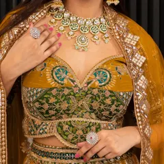 A close-up of the sweetheart neckline blouse and the stunning jewellery paired with the mustard lehenga. I can help you rent the entire coordinated look.