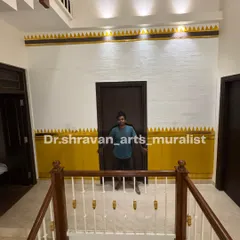 Here I am with a finished Chettinad-inspired border. The sharp geometric patterns in yellow and gold against a textured white wall bring a touch of traditional minimalism to this hallway.