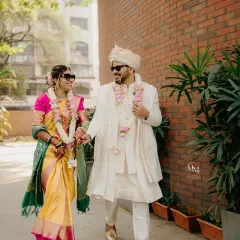 The 'cool' bride and groom, walking hand-in-hand after their wedding ceremony. This shot perfectly blends tradition with a modern, fun attitude.