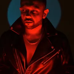 Slipped out of your hands. A dramatic, red-lit portrait that captures the edgy and charismatic side of my persona.