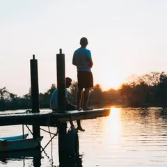 Two friends enjoying the sunset from the dock. These are the quiet, peaceful moments that make a trip to Area 83 special.