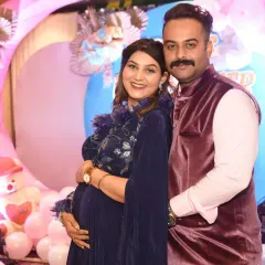 A tender moment between the parents-to-be. These candid shots, filled with smiles and affection, are just as important as the posed ones.
