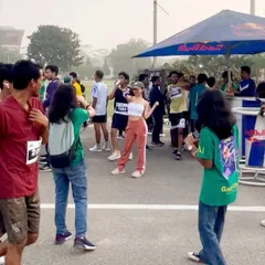 Interacting with participants at a Red Bull station during the Guwahati Half Marathon. My event services often include engaging with the audience directly to create a lively atmosphere.