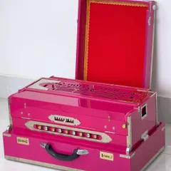 A stunning custom harmonium in a vibrant pink finish. Our harmoniums are crafted for superior sound and durability, with options for scale changers and multiple reeds.