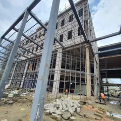 The Karkinos Manipur Cancer Care Institute under construction, showing the hybrid system of a concrete base with a steel superstructure. This approach optimizes material use and streamlines the building process.