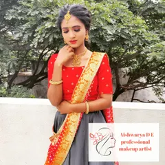 A beautiful sangeet or mehendi look in a half-saree style lehenga. The makeup is fresh and radiant, with a soft smokey eye and a hairstyle that is both elegant and comfortable for dancing.