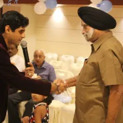 A heartfelt moment interacting with an elderly guest who loved the show. My goal as an emcee is to connect with the audience personally, making everyone feel welcome and entertained.