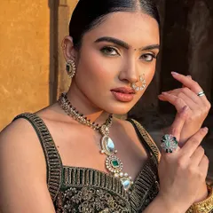 This shot highlights the beautiful jewellery and the way the makeup complements it, creating a cohesive and stylish look.