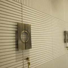 A close-up of the custom hardware and intricate fluting on this bespoke wardrobe. Every detail is chosen to complement the overall design and add a touch of luxury.