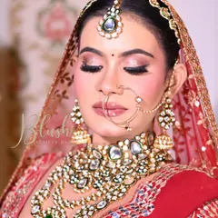 A close-up of a student's bridal creation. The eye makeup is perfectly executed, with a sharp winged liner and beautifully blended shadows.