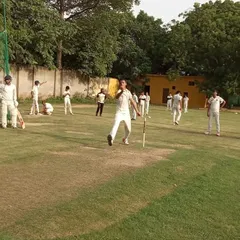 A bowler celebrates taking a wicket during an intra-academy practice match. These games help build a competitive spirit and teach players how to handle pressure.