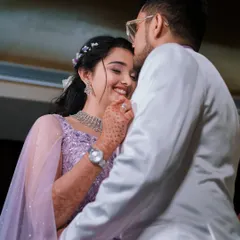 A close-up of the couple's first dance, her joyful smile and his tender embrace say it all. This is pure reception magic.