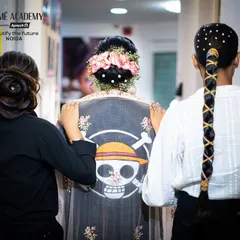 Three different advanced hairstyles showcased together. From a floral bun to a creative braid, our students learn a wide range of styles to build a diverse portfolio.